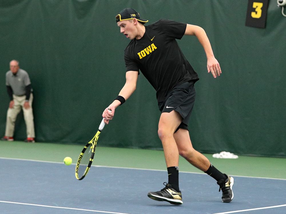 Iowa’s Joe Tyler returns a shot during his doubles match at the Hawkeye Tennis and Recreation Complex in Iowa City on Friday, February 14, 2020. (Stephen Mally/hawkeyesports.com)