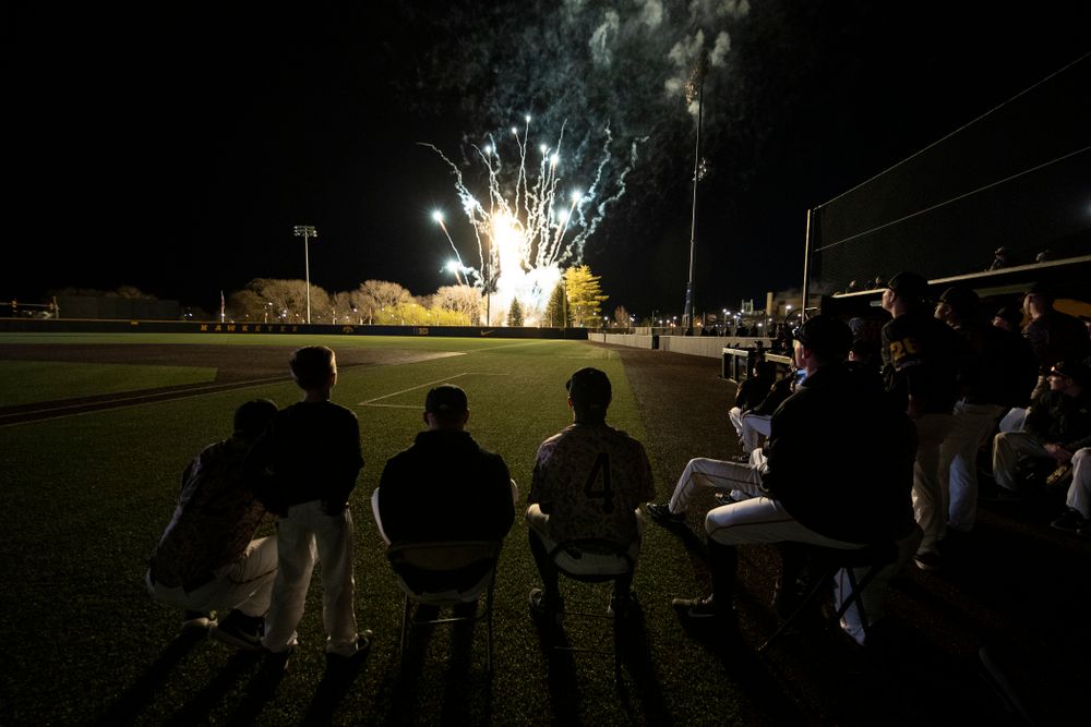 The Iowa Hawkeyes watch the fireworks following their game against the Nebraska Cornhuskers on Military Appreciation Night Friday, April 19, 2019 at Duane Banks Field. (Brian Ray/hawkeyesports.com)