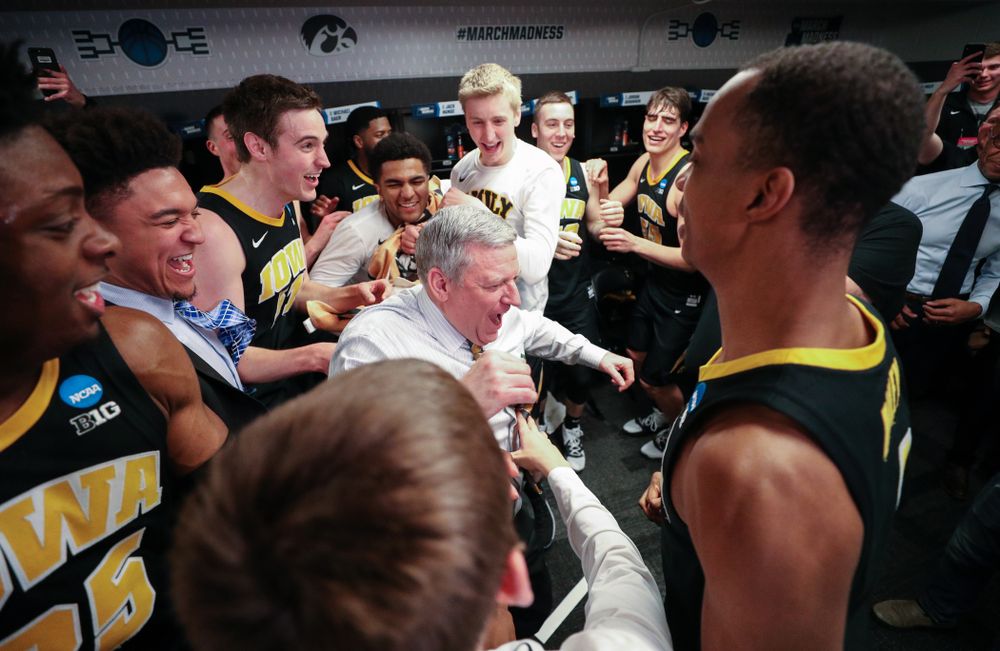 Iowa Hawkeyes assistant coach Kirk Speraw dances with the team following their win against the Cincinnati Bearcats in the first round of the 2019 NCAA Men's Basketball Tournament Friday, March 22, 2019 at Nationwide Arena in Columbus, Ohio. (Brian Ray/hawkeyesports.com)