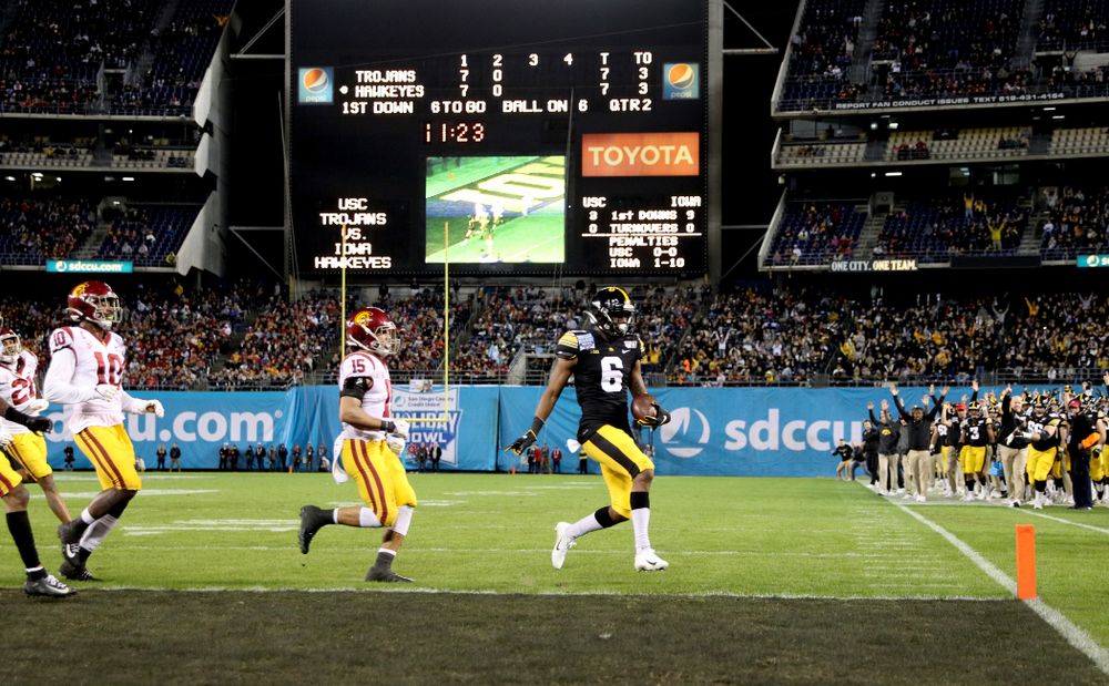 Iowa Hawkeyes wide receiver Ihmir Smith-Marsette (6) scores a touchdown against USC in the Holiday Bowl Friday, December 27, 2019 at San Diego Community Credit Union Stadium.  (Brian Ray/hawkeyesports.com)