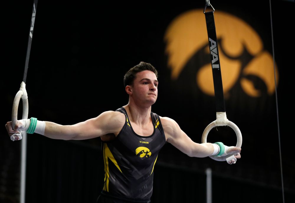 Jake Brodarzon competes on the rings against Minnesota and Air Force 