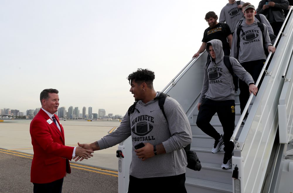Iowa Hawkeyes offensive lineman Tristan Wirfs (74) shakes hands with the ÒRed CoatsÓ after arriving in San Diego, CA Saturday, December 21, 2019 for the Holiday Bowl. (Brian Ray/hawkeyesports.com)