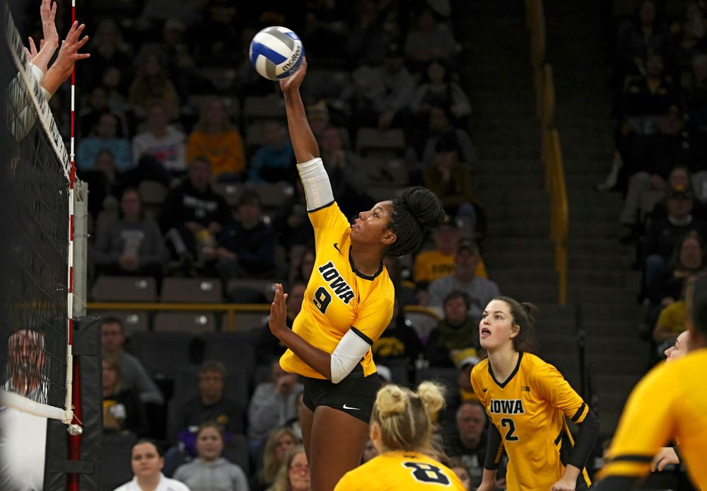 Iowa’s Amiya Jones (9) lines up a shot during the first set of their match at Carver-Hawkeye Arena in Iowa City on Friday, Nov 29, 2019. (Stephen Mally/hawkeyesports.com)