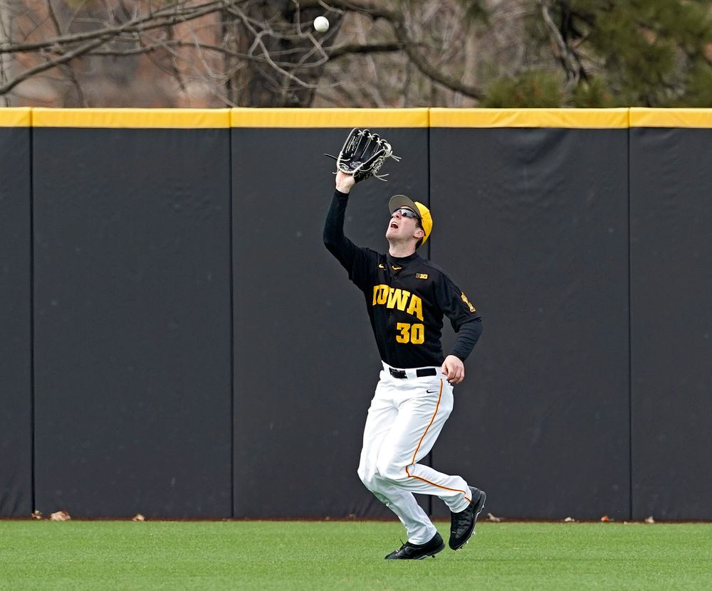 Iowa Hawkeyes left fielder Connor McCaffery (30) pulls in a fly ball for an out during the fifth inning of their game against Illinois at Duane Banks Field in Iowa City on Saturday, Mar. 30, 2019. (Stephen Mally/hawkeyesports.com)