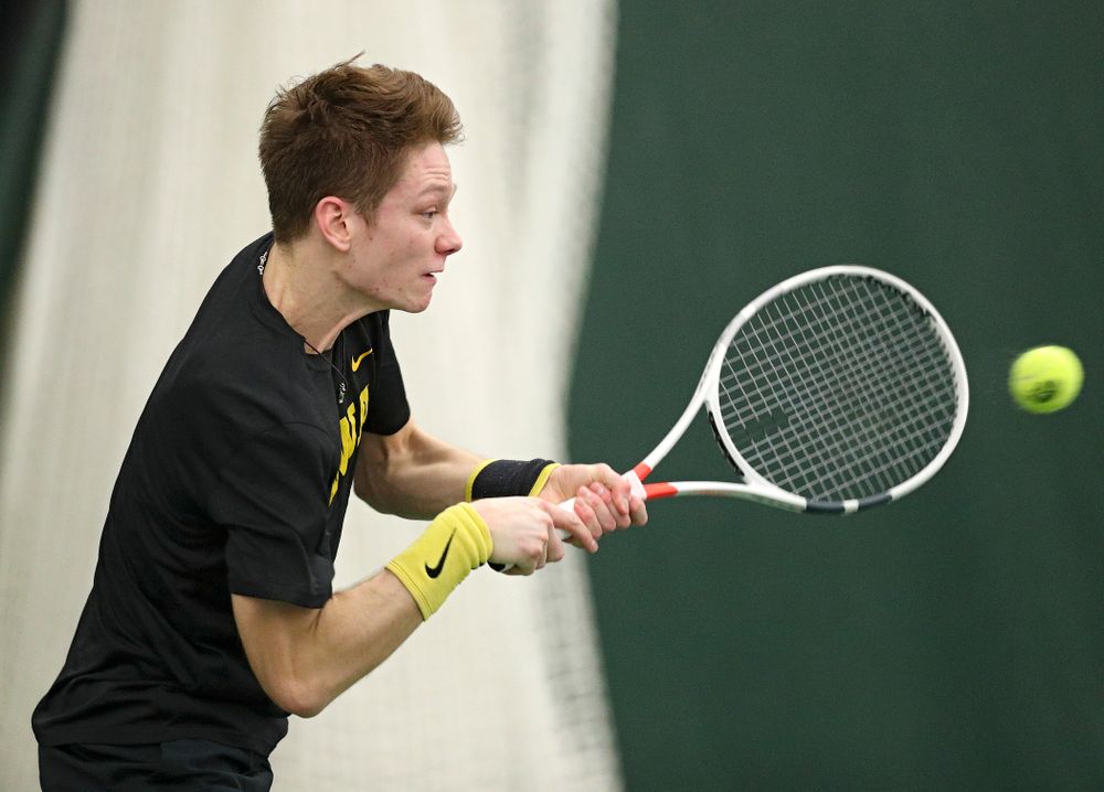 Iowa’s Jason Kerst hits a shot during his match against Marquette at the Hawkeye Tennis and Recreation Complex in Iowa City on Saturday, January 25, 2020. (Stephen Mally/hawkeyesports.com)