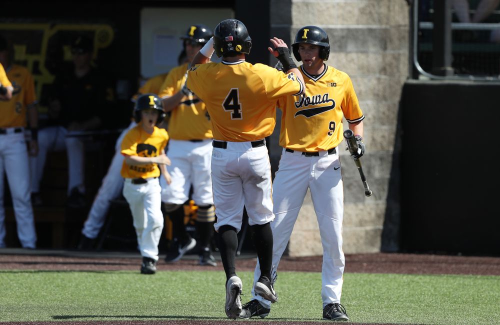 Iowa Hawkeyes infielder Mitchell Boe (4) and outfielder Ben Norman (9) against the Nebraska Cornhuskers Sunday, April 21, 2019 at Duane Banks Field. (Brian Ray/hawkeyesports.com)