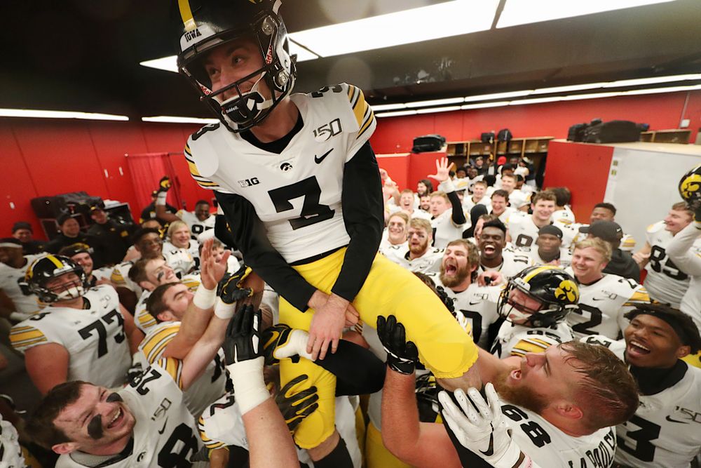 The Iowa Hawkeyes hoist up place kicker Keith Duncan (3) as they celebrate their victory against the Nebraska Cornhuskers Friday, November 29, 2019 at Memorial Stadium in Lincoln, Neb. (Brian Ray/hawkeyesports.com)