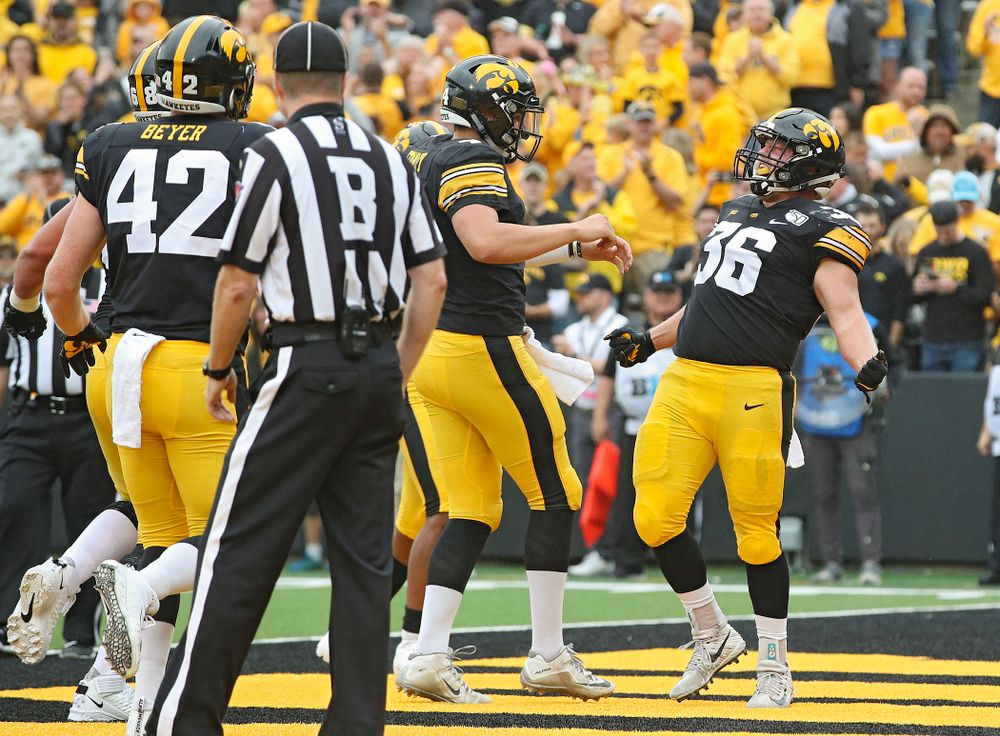 Iowa Hawkeyes fullback Brady Ross (36) celebrates his 1-yard touchdown run with quarterback Nate Stanley (4) during the second quarter of their game at Kinnick Stadium in Iowa City on Saturday, Sep 28, 2019. (Stephen Mally/hawkeyesports.com)