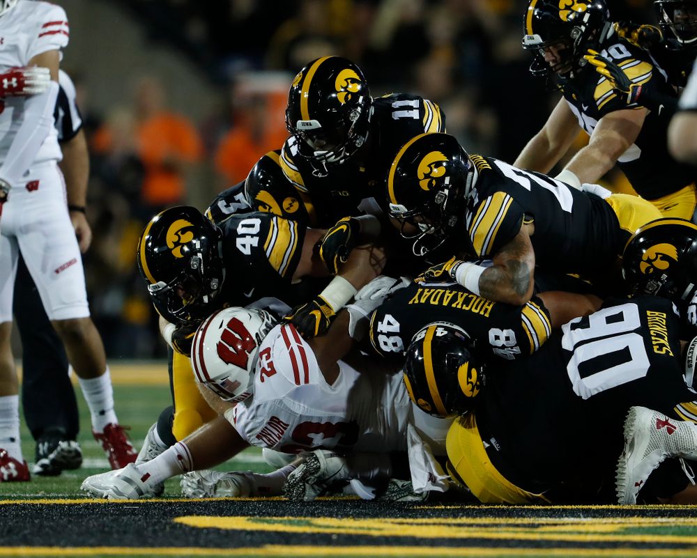 Iowa Hawkeyes defensive end Parker Hesse (40), defensive back Michael Ojemudia (11), and linebacker Jack Hockaday (48) against the Wisconsin Badgers Saturday, September 22, 2018 at Kinnick Stadium. (Brian Ray/hawkeyesports.com)