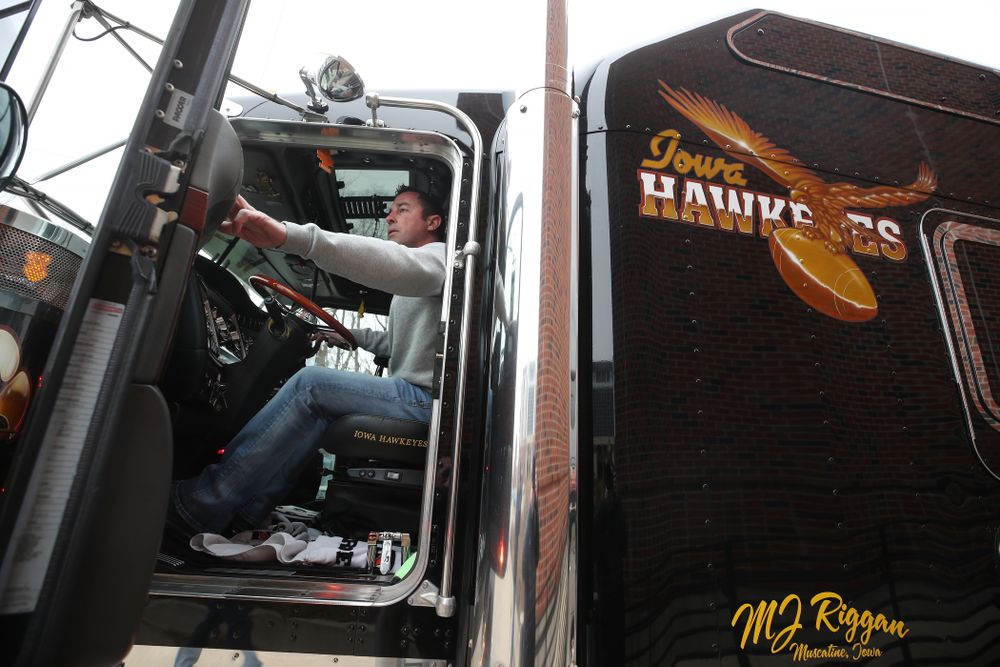TanTara Transportation Corporation operations manager Jeff Riggan helps hook up Hawk One to the trailer before the truck departed for the Outback Bowl in Tampa, Florida  Friday, December 21, 2018 at the Hansen Football Performance Center. (Brian Ray/hawkeyesports.com)