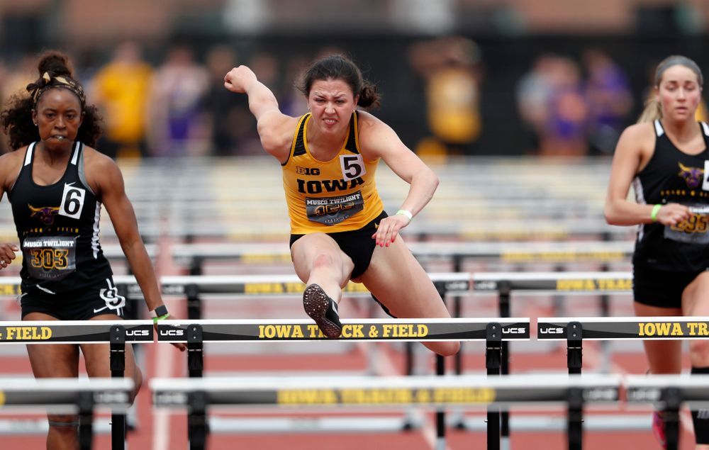 Iowa's Jenny Kimbro competes in the 100 meter hurdles during the 2018 MUSCO Twilight Invitational  Thursday, April 12, 2018 at the Cretzmeye