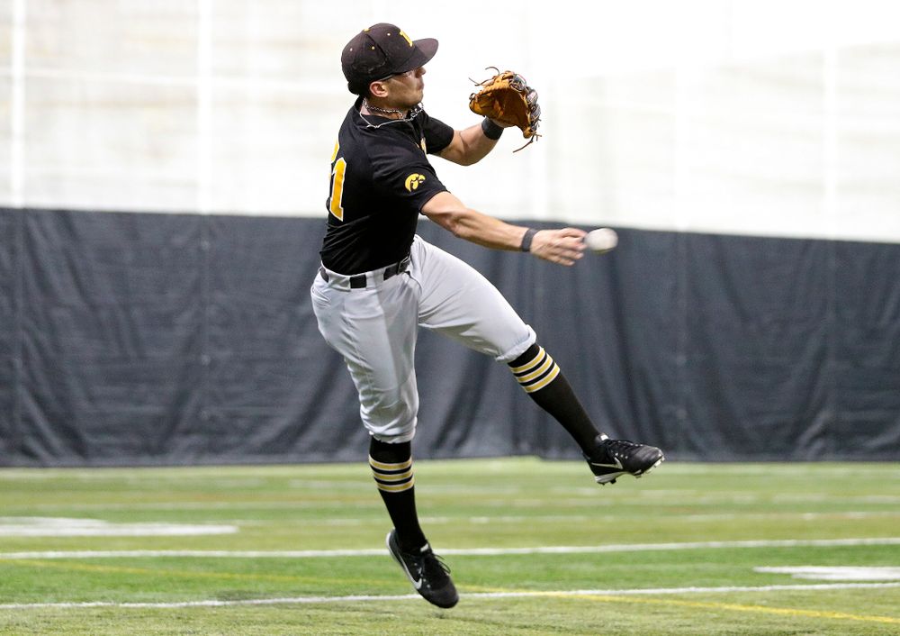 Iowa Hawkeyes infielder Matthew Sosa (31) throws to first base during practice at the Hansen Football Performance Center in Iowa City on Friday, January 24, 2020. (Stephen Mally/hawkeyesports.com)