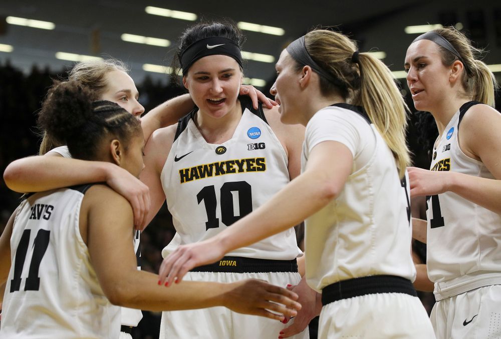 Iowa Hawkeyes guard Tania Davis (11), guard Kathleen Doyle (22), center Megan Gustafson (10), guard Makenzie Meyer (3), and forward Hannah Stewart (21) huddle and talk during the fourth quarter of their second round game in the 2019 NCAA Women's Basketball Tournament at Carver Hawkeye Arena in Iowa City on Sunday, Mar. 24, 2019. (Stephen Mally for hawkeyesports.com)