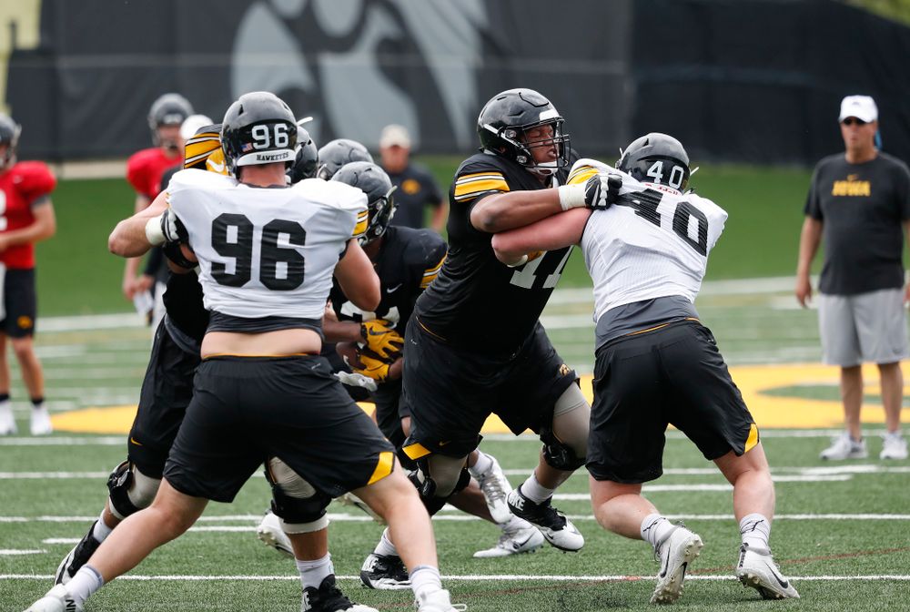 Iowa Hawkeyes offensive lineman Alaric Jackson (77) and defensive end Parker Hesse (40) during practice No. 4 of Fall Camp Monday, August 6, 2018 at the Hansen Football Performance Center. (Brian Ray/hawkeyesports.com)