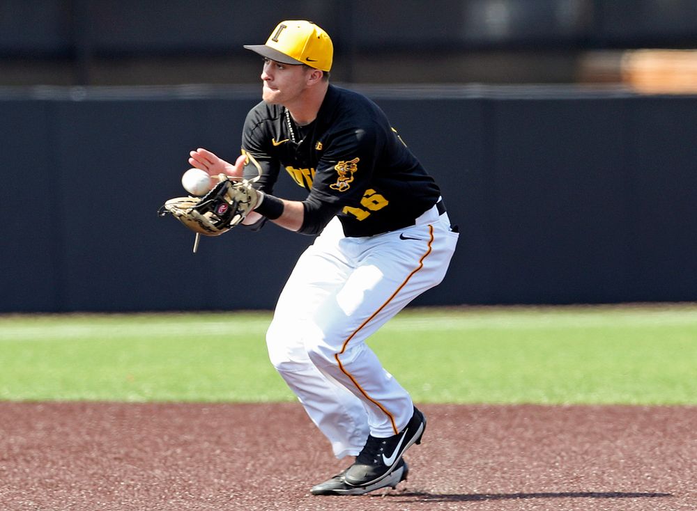 Iowa Hawkeyes shortstop Tanner Wetrich (16) pulls in a ball during the first inning of their game against Rutgers at Duane Banks Field in Iowa City on Saturday, Apr. 6, 2019. (Stephen Mally/hawkeyesports.com)