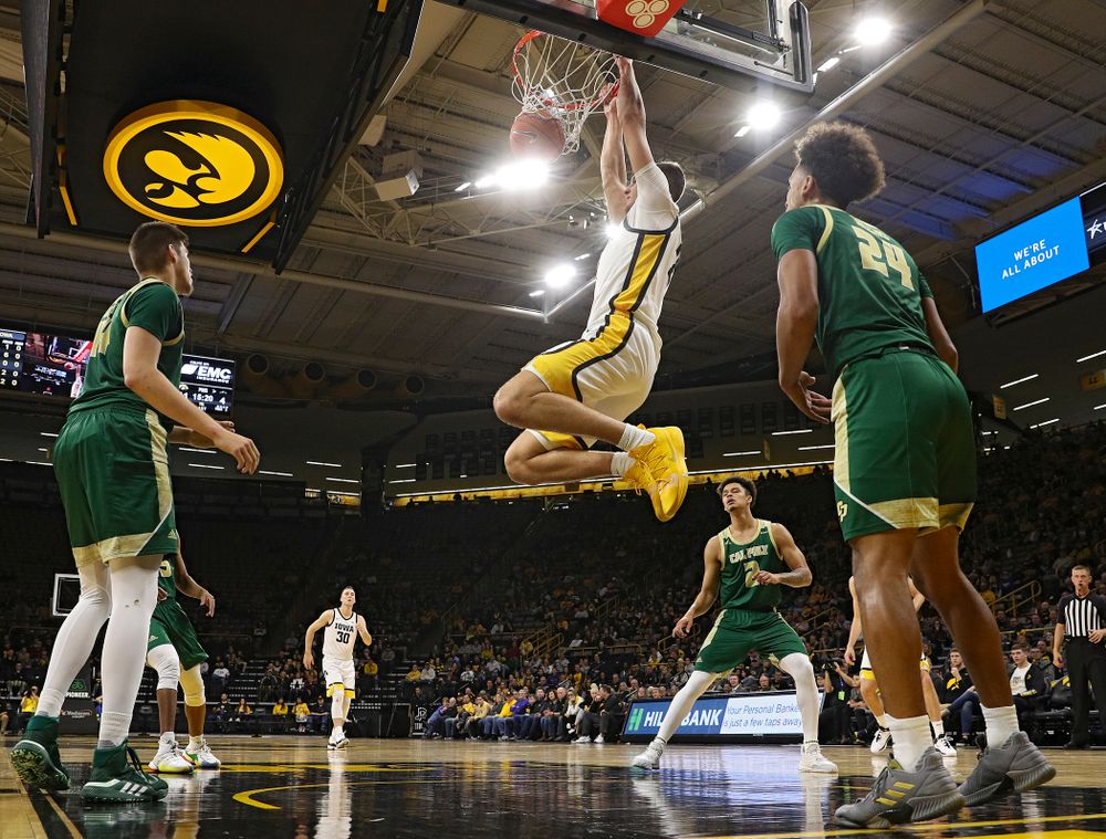 Iowa Hawkeyes forward Jack Nunge (2) dunks the ball during the first half of their game at Carver-Hawkeye Arena in Iowa City on Sunday, Nov 24, 2019. (Stephen Mally/hawkeyesports.com)