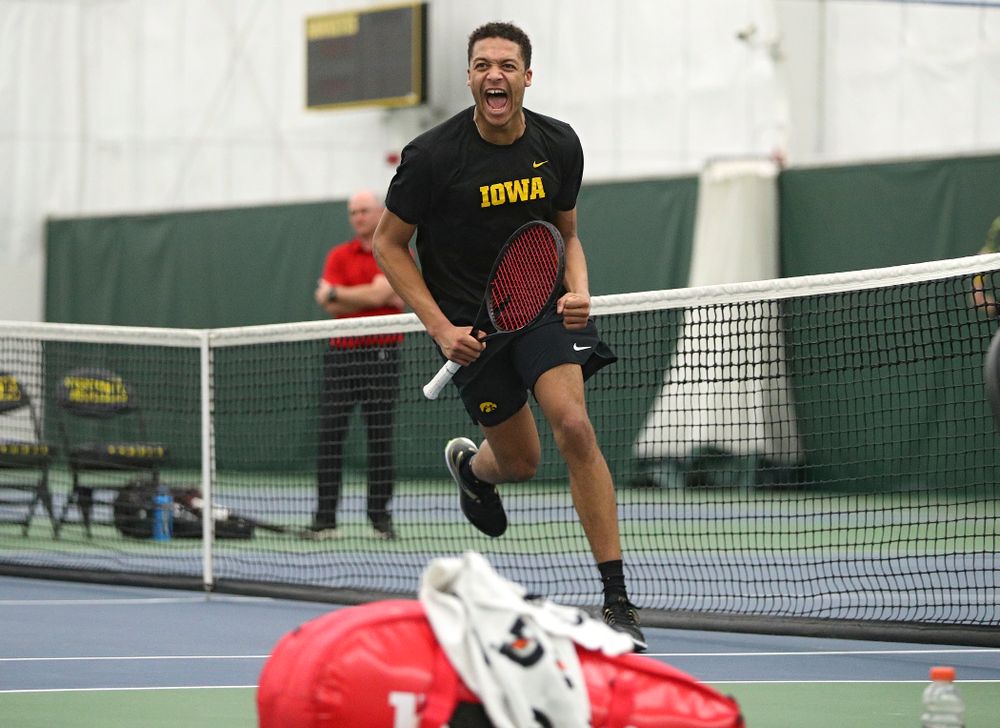 Iowa’s Oliver Okonkwo celebrates after winning his singles match at the Hawkeye Tennis and Recreation Complex in Iowa City on Friday, March 6, 2020. (Stephen Mally/hawkeyesports.com)