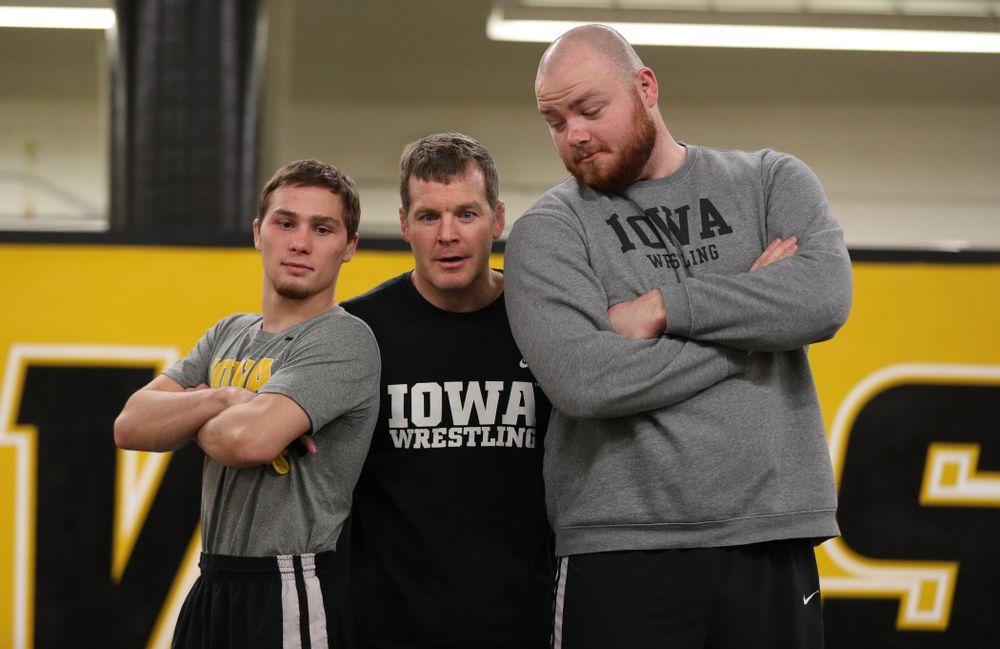 Iowa Hawkeyes head coach Tom Brands photobombs Spencer Lee and Sam Stoll during the team's annual media day Monday, November 5, 2018 at Carver-Hawkeye Arena. (Brian Ray/hawkeyesports.com)