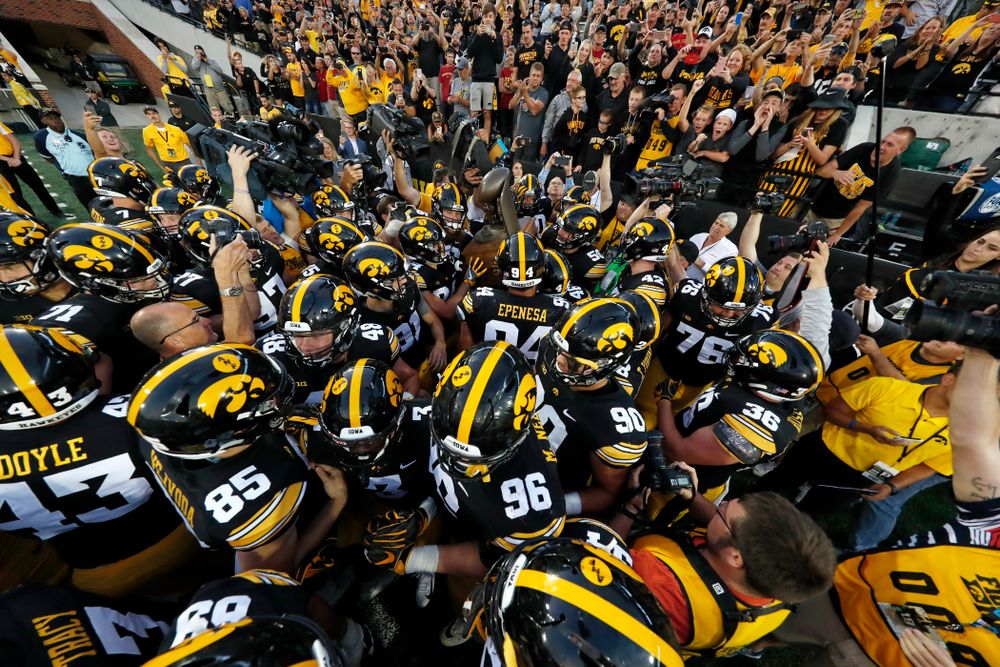 The Iowa Hawkeyes celebrate with the Cy-Hawk trophy following their game against the Iowa State Cyclones Saturday, September 8, 2018 at Kinnick Stadium. (Brian Ray/hawkeyesports.com)