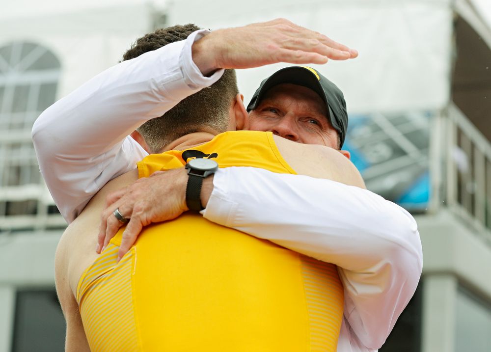 Iowa Director of Track and Field Joey Woody (right) hugs Chris Douglas after Douglas won the men’s 400 meter hurdles event on the third day of the Big Ten Outdoor Track and Field Championships at Francis X. Cretzmeyer Track in Iowa City on Sunday, May. 12, 2019. (Stephen Mally/hawkeyesports.com)