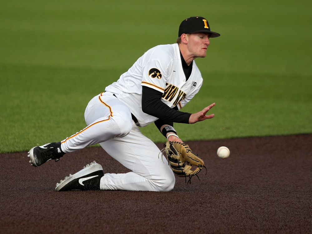 Iowa infielder Brendan Sher (2) fields a ground ball as they turn a double play during the eighth inning of their college baseball game at Duane Banks Field in Iowa City on Wednesday, March 11, 2020. (Stephen Mally/hawkeyesports.com)