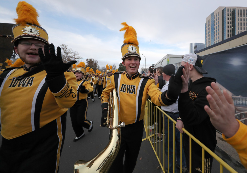 The Hawkeye Marching Band and the Iowa Spirit Squad march in the Holiday Bowl Parade Thursday, December 26, 2019 in San Diego. (Brian Ray/hawkeyesports.com)