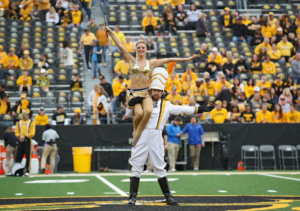 Hawkeye Marching Band Golden Girl Kylene Spanbauer (from left) and Drum Major Michael Janssen on the field with the Hawkeye Marching Band before their game at Kinnick Stadium in Iowa City on Saturday, Sep 28, 2019. (Stephen Mally/hawkeyesports.com)