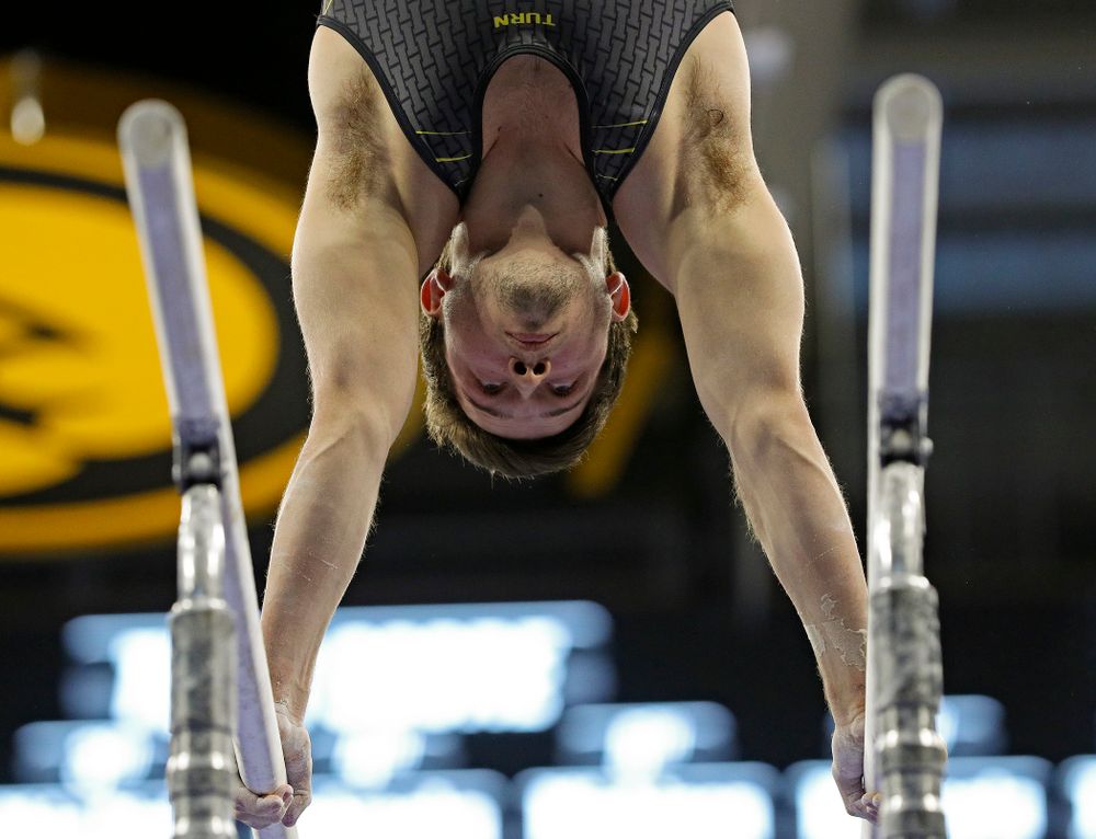 Iowa's Rogelio Vazquez competes in the parallel bars during the first day of the Big Ten Men's Gymnastics Championships at Carver-Hawkeye Arena in Iowa City on Friday, Apr. 5, 2019. (Stephen Mally/hawkeyesports.com)