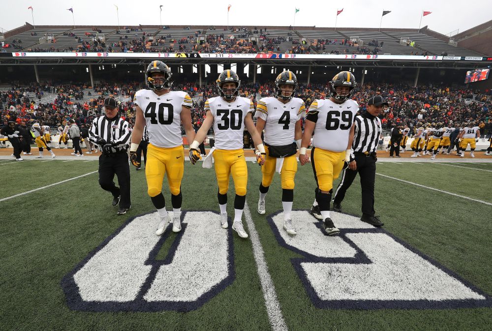 Iowa Hawkeyes captains Parker Hesse, Jake Gervase, Nate Stanley, and Keegan Render against the Illinois Fighting Illini Saturday, November 17, 2018 at Memorial Stadium in Champaign, Ill. (Brian Ray/hawkeyesports.com)