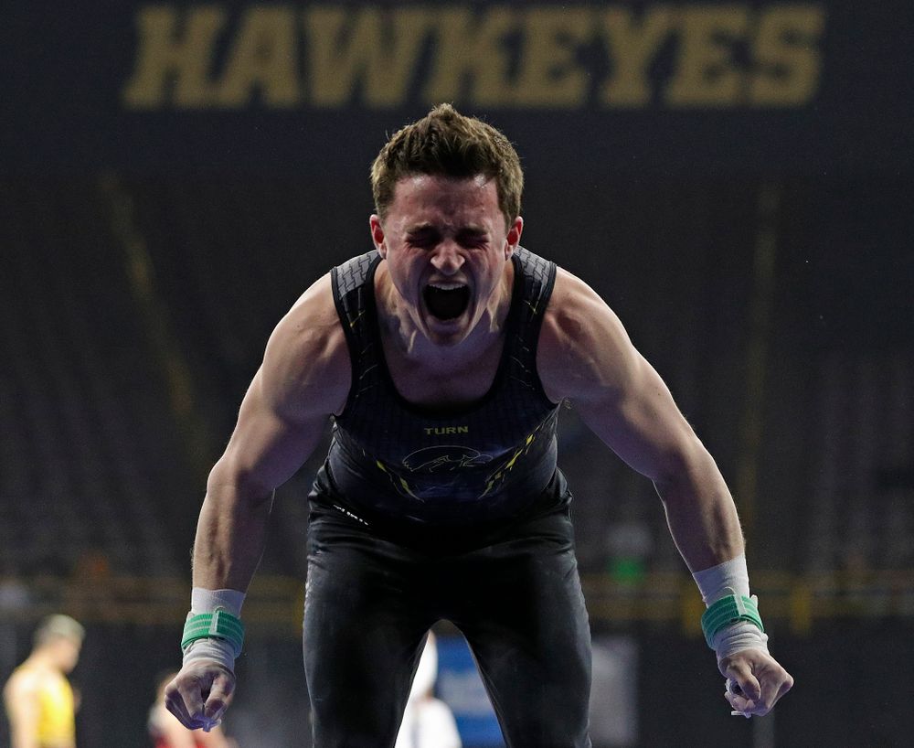 Iowa's Jake Brodarzon is pumped up after competing in the rings during the first day of the Big Ten Men's Gymnastics Championships at Carver-Hawkeye Arena in Iowa City on Friday, Apr. 5, 2019. (Stephen Mally/hawkeyesports.com)