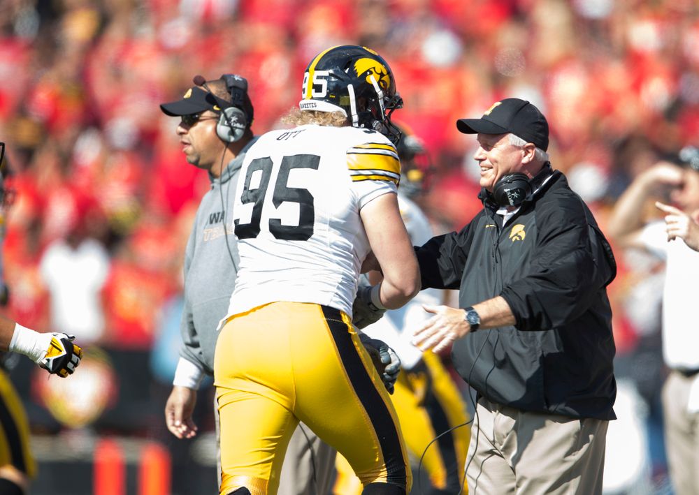 Iowa Hawkeyes defensive lineman Drew Ott (95) celebrates with defensive line coach Reese Morgan after intercepting a pass during the first half of their game Saturday, Oct. 18, 2014 at Byrd Stadium in College Park, Md.  (Brian Ray/hawkeyesports.com)
