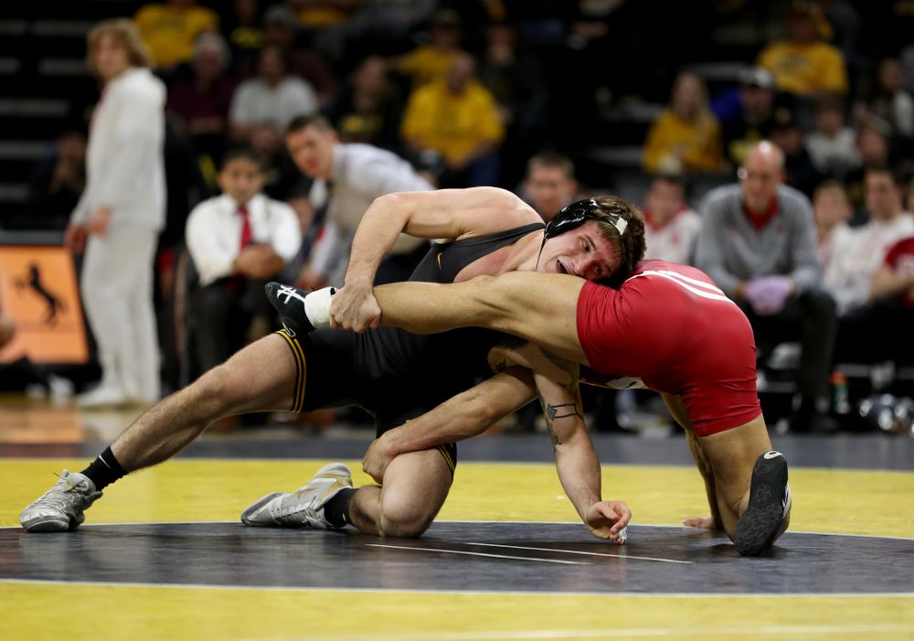 IowaÕs Cash Wilcke wrestles WisconsinÕs Johnny Sebastian at 184 pounds Sunday, December 1, 2019 at Carver-Hawkeye Arena. Sebastian won the match in overtime 7-5. (Brian Ray/hawkeyesports.com)