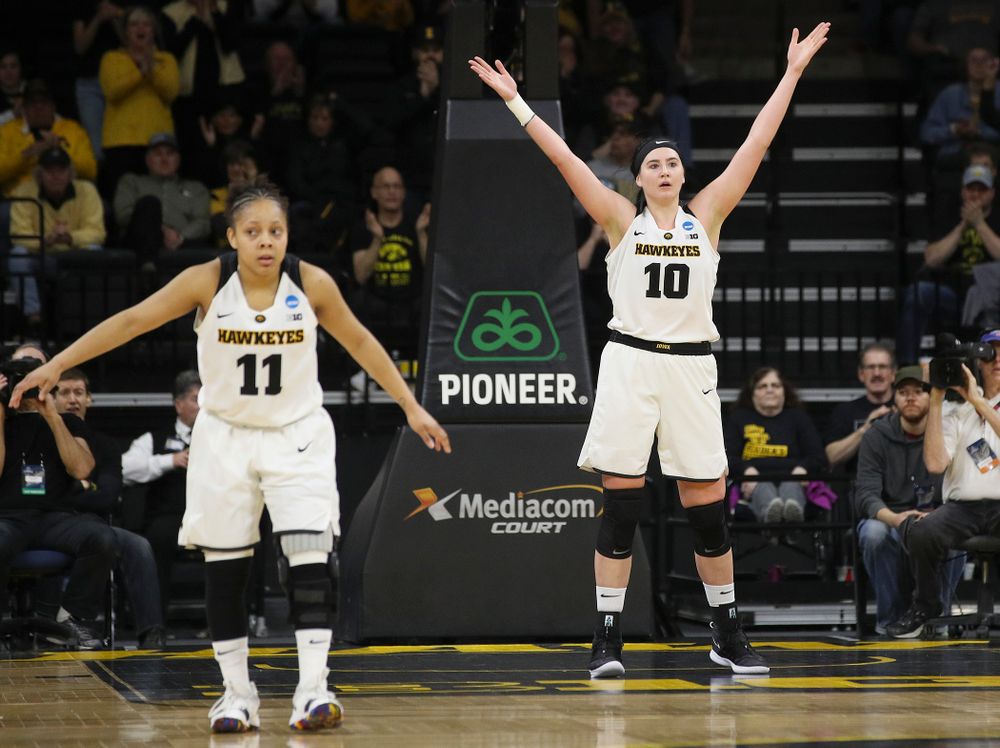 Iowa Hawkeyes center Megan Gustafson (10) pumps up the crowd as guard Tania Davis (11) defends during the second quarter of their second round game in the 2019 NCAA Women's Basketball Tournament at Carver Hawkeye Arena in Iowa City on Sunday, Mar. 24, 2019. (Stephen Mally for hawkeyesports.com)