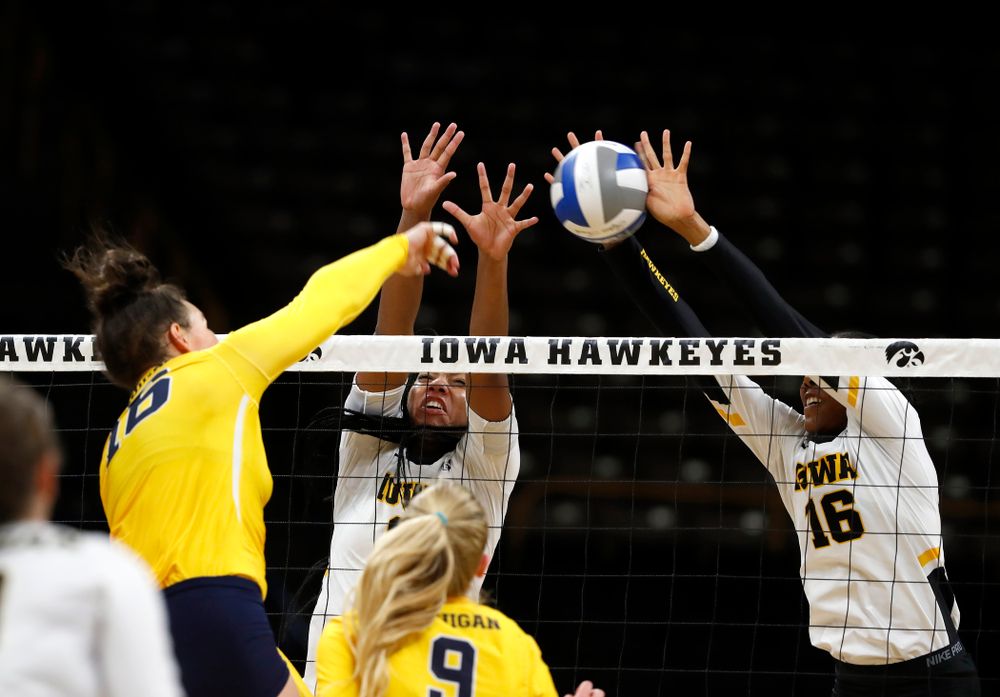 Iowa Hawkeyes middle blocker Amiya Jones (9) and outside hitter Taylor Louis (16) against the Michigan Wolverines Sunday, September 23, 2018 at Carver-Hawkeye Arena. (Brian Ray/hawkeyesports.com)