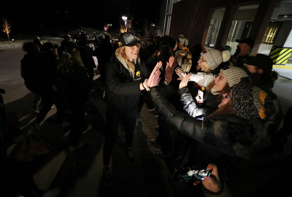 Iowa Hawkeyes forward Hannah Stewart (21) celebrates with fans as they arrive back in Coralville after defeating the Maryland Terrapins in the Big Ten Championship Game Sunday, March 10, 2019 in Indianapolis, Ind. (Brian Ray/hawkeyesports.com)