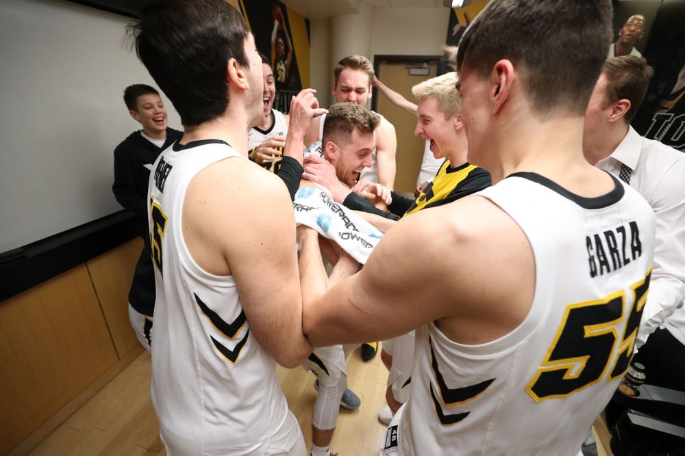 Iowa Hawkeyes guard Jordan Bohannon (3) celebrates with his teammates in the locker room following their win against the Northwestern Wildcats Sunday, February 10, 2019 at Carver-Hawkeye Arena. (Brian Ray/hawkeyesports.com)