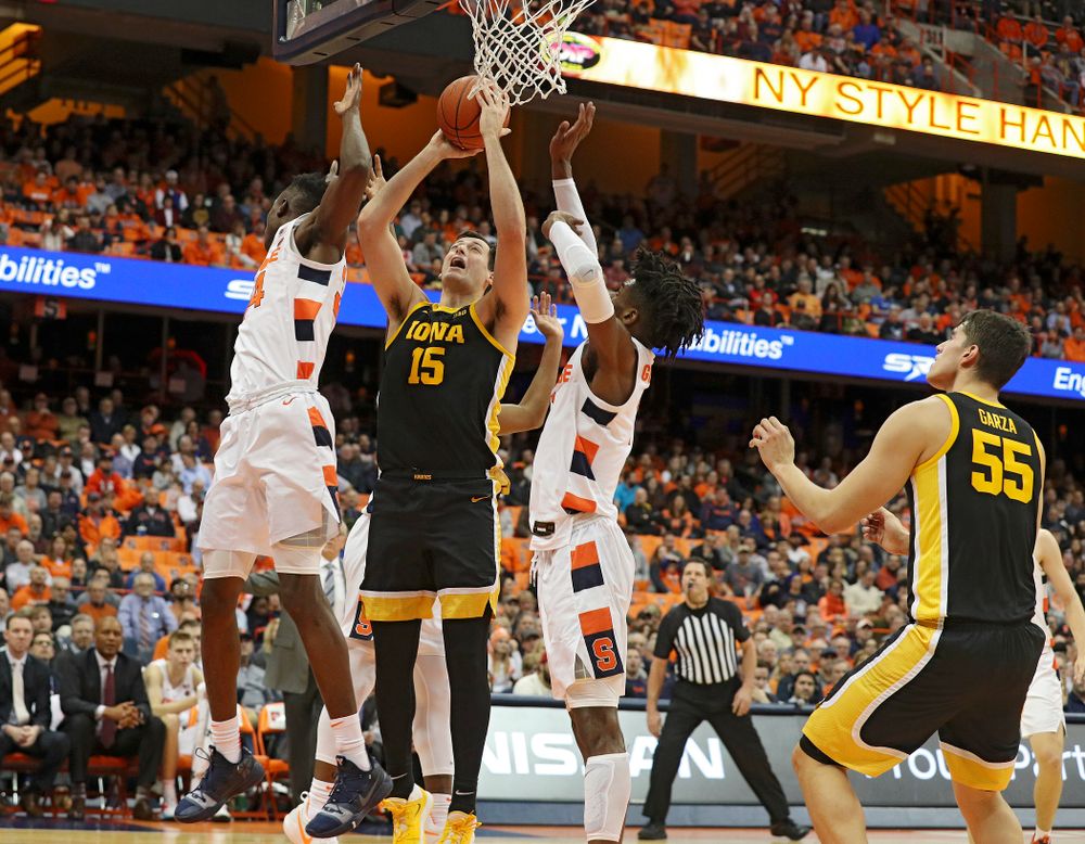 Iowa Hawkeyes forward Ryan Kriener (15) makes a basket during the first half of their ACC/Big Ten Challenge game at the Carrier Dome in Syracuse, N.Y. on Tuesday, Dec 3, 2019. (Stephen Mally/hawkeyesports.com)