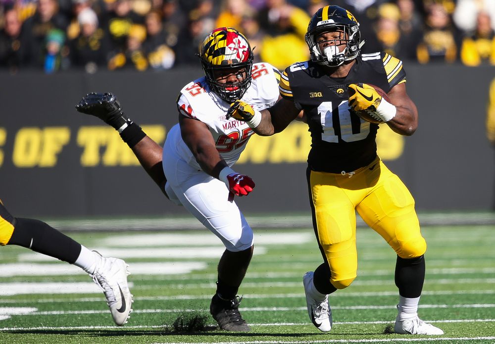 Iowa Hawkeyes running back Mekhi Sargent (10) breaks a tackle during a game against Maryland at Kinnick Stadium on October 20, 2018. (Tork Mason/hawkeyesports.com)