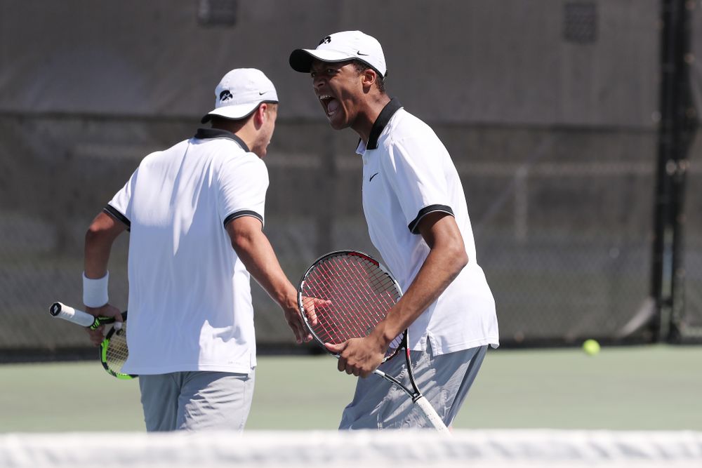 IowaÕs Oliver Okonkwo and Will Davies play a doubles match against the Michigan Wolverines Sunday, April 21, 2019 at the Hawkeye Tennis and Recreation Complex. (Brian Ray/hawkeyesports.com)
