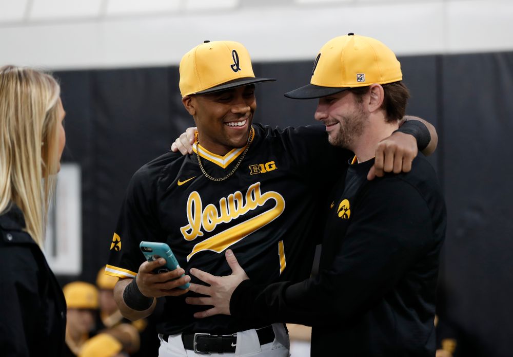 Iowa Hawkeyes third baseman Lorenzo Elion (1) and infielder Chris Whelan (28) during the team's annual media day Thursday, February 8, 2018 in the indoor practice facility. (Brian Ray/hawkeyesports.com)