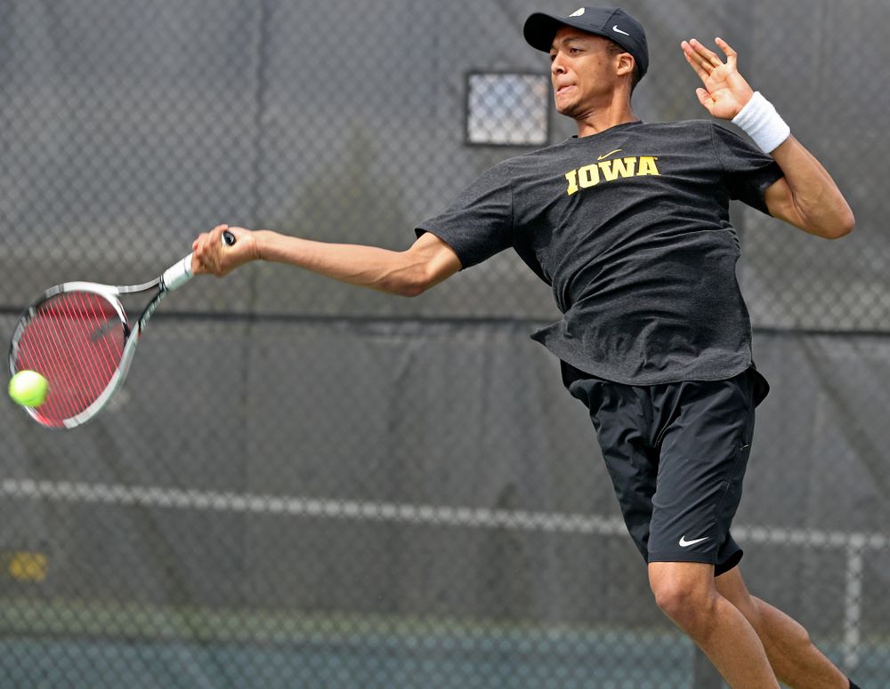 Iowa's Oliver Okonkwo competes during a match against Ohio State at the Hawkeye Tennis and Recreation Complex in Iowa City on Sunday, Apr. 7, 2019. (Stephen Mally/hawkeyesports.com)