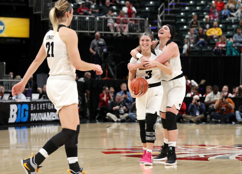 Iowa Hawkeyes guard Makenzie Meyer (3) and forward Megan Gustafson (10) celebrate against the Indiana Hoosiers in the quarterfinals of the Big Ten Tournament Friday, March 8, 2019 at Bankers Life Fieldhouse in Indianapolis, Ind. (Brian Ray/hawkeyesports.com)