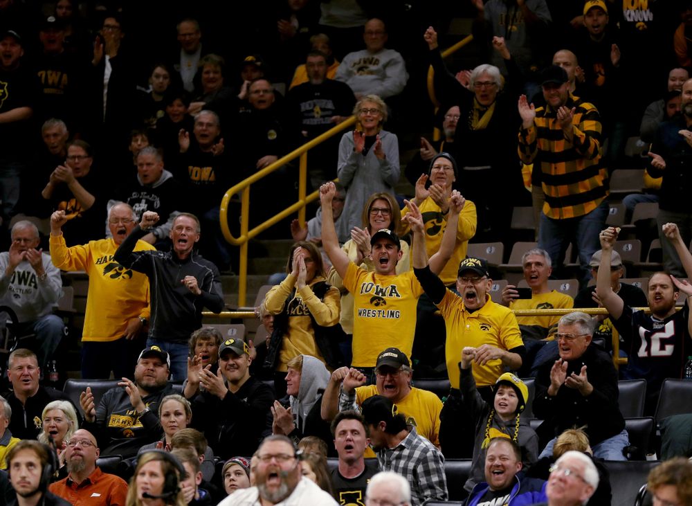 Fans cheer on IowaÕs Austin DeSanto as he wrestles WisconsinÕs  Seth Gross at 133 pounds Sunday, December 1, 2019 at Carver-Hawkeye Arena. DeSanto won the match 6-2. (Brian Ray/hawkeyesports.com)