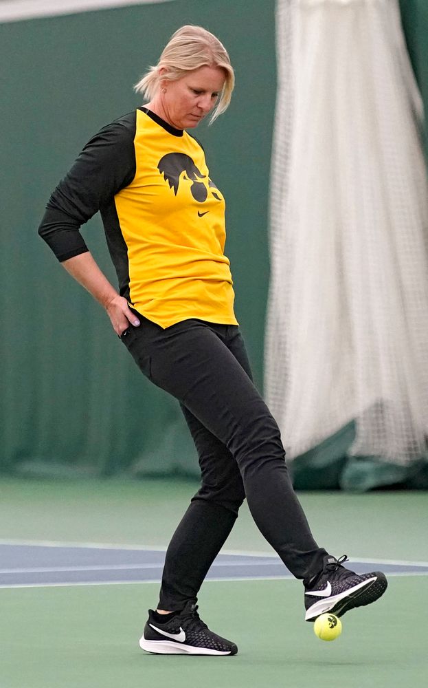 Iowa head coach Sasha Schmid stops a ball during their match against Indiana at the Hawkeye Tennis and Recreation Complex in Iowa City on Sunday, Mar. 31, 2019. (Stephen Mally/hawkeyesports.com)