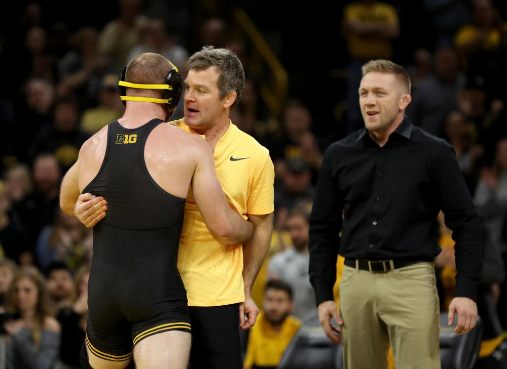 IowaÕs Alex Marinelli hugs head coach Tom Brands after defeating WisconsinÕs Evan Wick at 165 pounds Sunday, December 1, 2019 at Carver-Hawkeye Arena. Marinelli won the match 4-2. (Brian Ray/hawkeyesports.com)