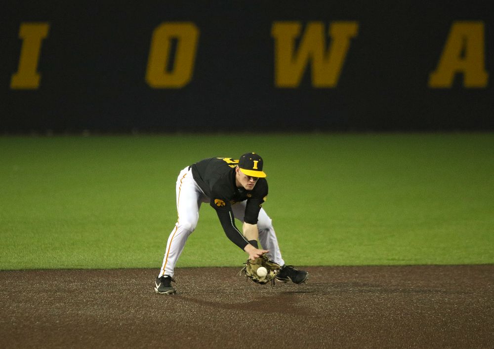Iowa infielder Brendan Sher (2) fields a ground ball during the seventh inning of their game at Duane Banks Field in Iowa City on Tuesday, March 3, 2020. (Stephen Mally/hawkeyesports.com)