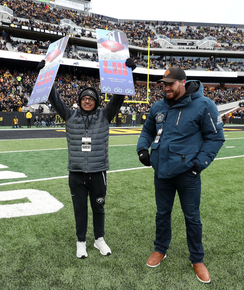 Former Hawkeye linebacker and current Denver Bronco Josey Jewel surprises former Kid Captain 
Parker Kress of Bettendorf with Super Bowl tickets during the Iowa Hawkeyes game against the Northwestern Wildcats Saturday, November 10, 2018 at Kinnick Stadium. (Brian Ray/hawkeyesports.com)