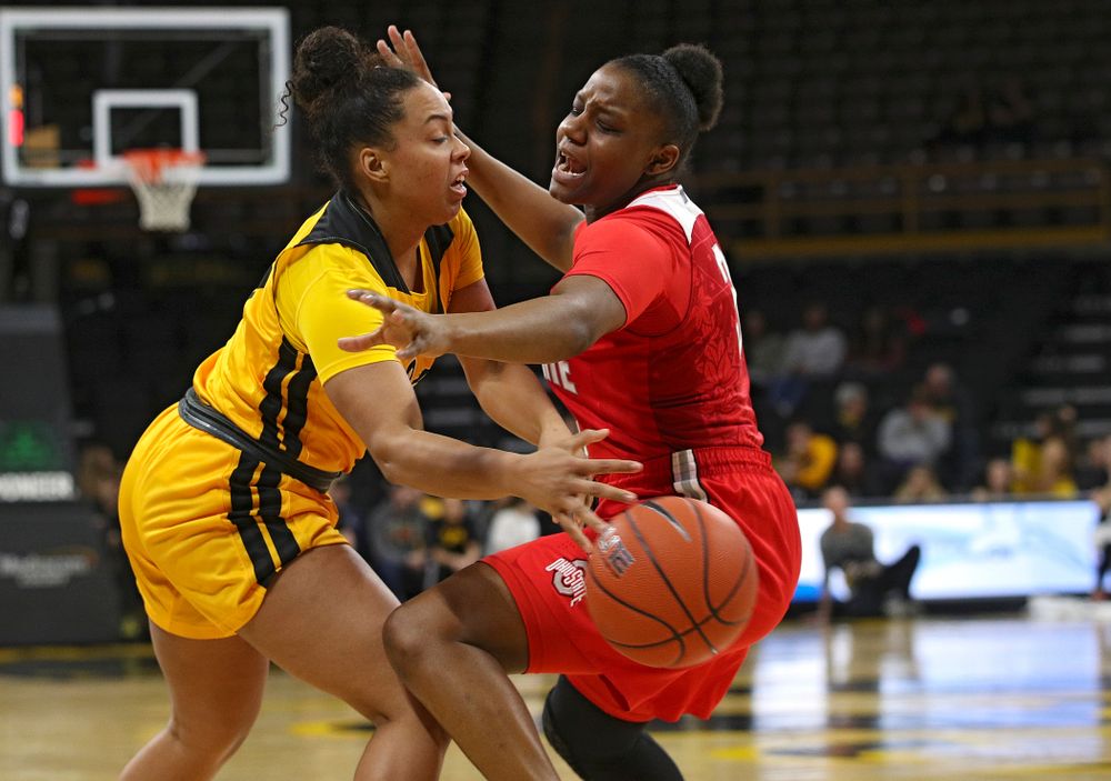Iowa Hawkeyes guard Alexis Sevillian (5) passes the ball around Ohio State Buckeyes guard Janai Crooms (3) during the fourth quarter of their game at Carver-Hawkeye Arena in Iowa City on Thursday, January 23, 2020. (Stephen Mally/hawkeyesports.com)