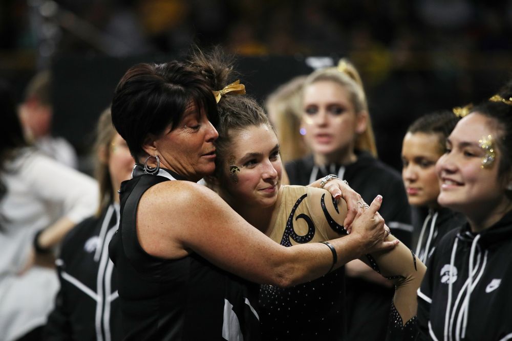 Iowa assistant coach Jennifer Green hugs Bridget Killian after her performance on the beam during their meet against Southeast Missouri State Friday, January 11, 2019 at Carver-Hawkeye Arena. (Brian Ray/hawkeyesports.com)