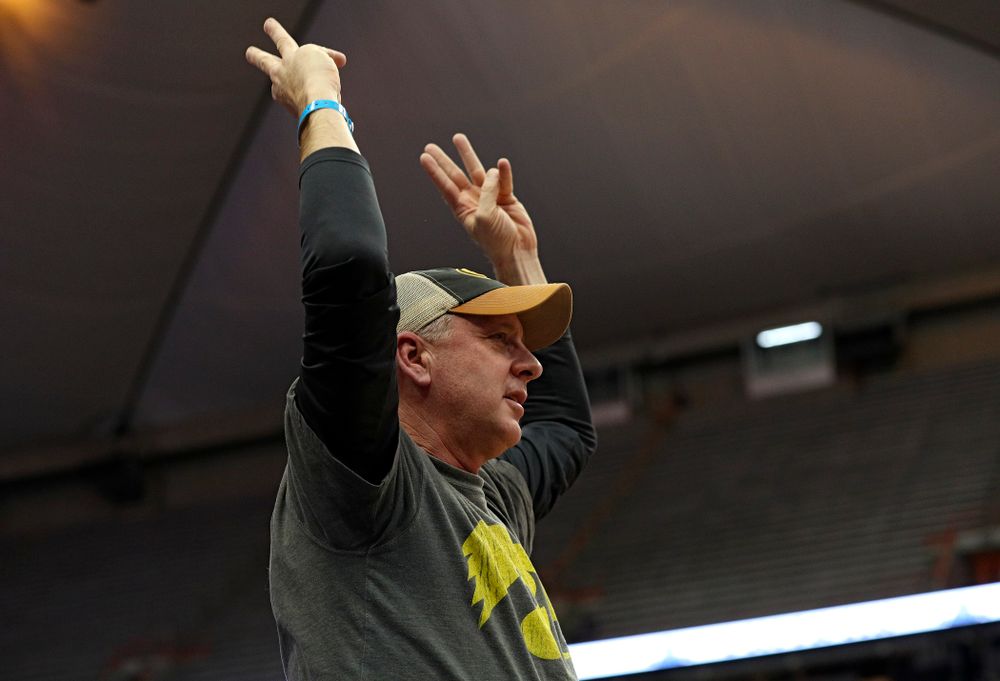 A Hawkeyes fans holds up three fingers in each after after an Iowa 3-pointer during the second half of their ACC/Big Ten Challenge game at the Carrier Dome in Syracuse, N.Y. on Tuesday, Dec 3, 2019. (Stephen Mally/hawkeyesports.com)